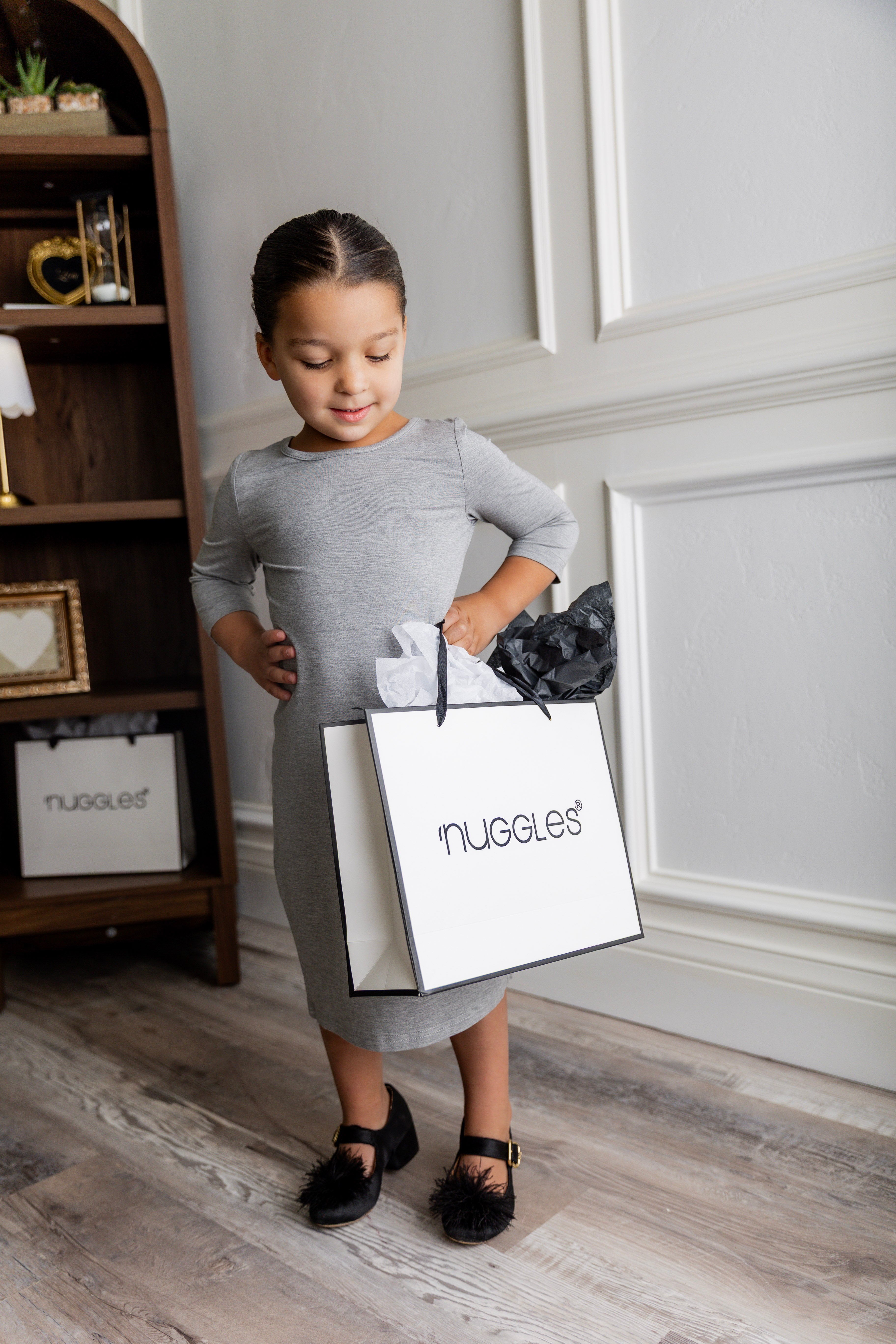 Model wearing our Nuggles® girls midi layering dress