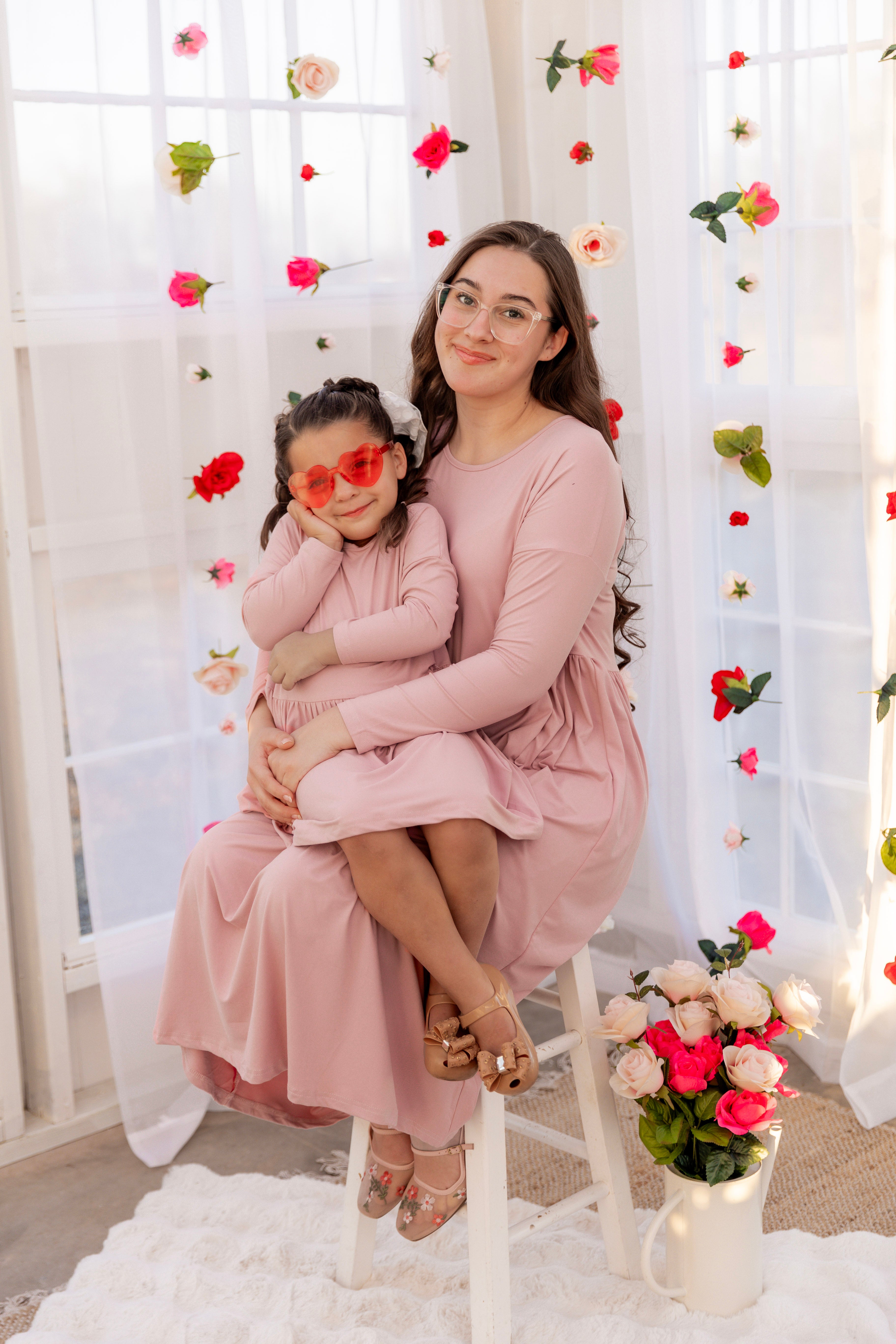 Model wearing the Nuggles® Girls' Farah Dress in Baby Pink
