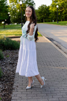 Modest sleeveless midi dress with tiered skirt and fitted bodice, styled for layering with a crew neckline – Hannah Layering Dress by Nuggles®.