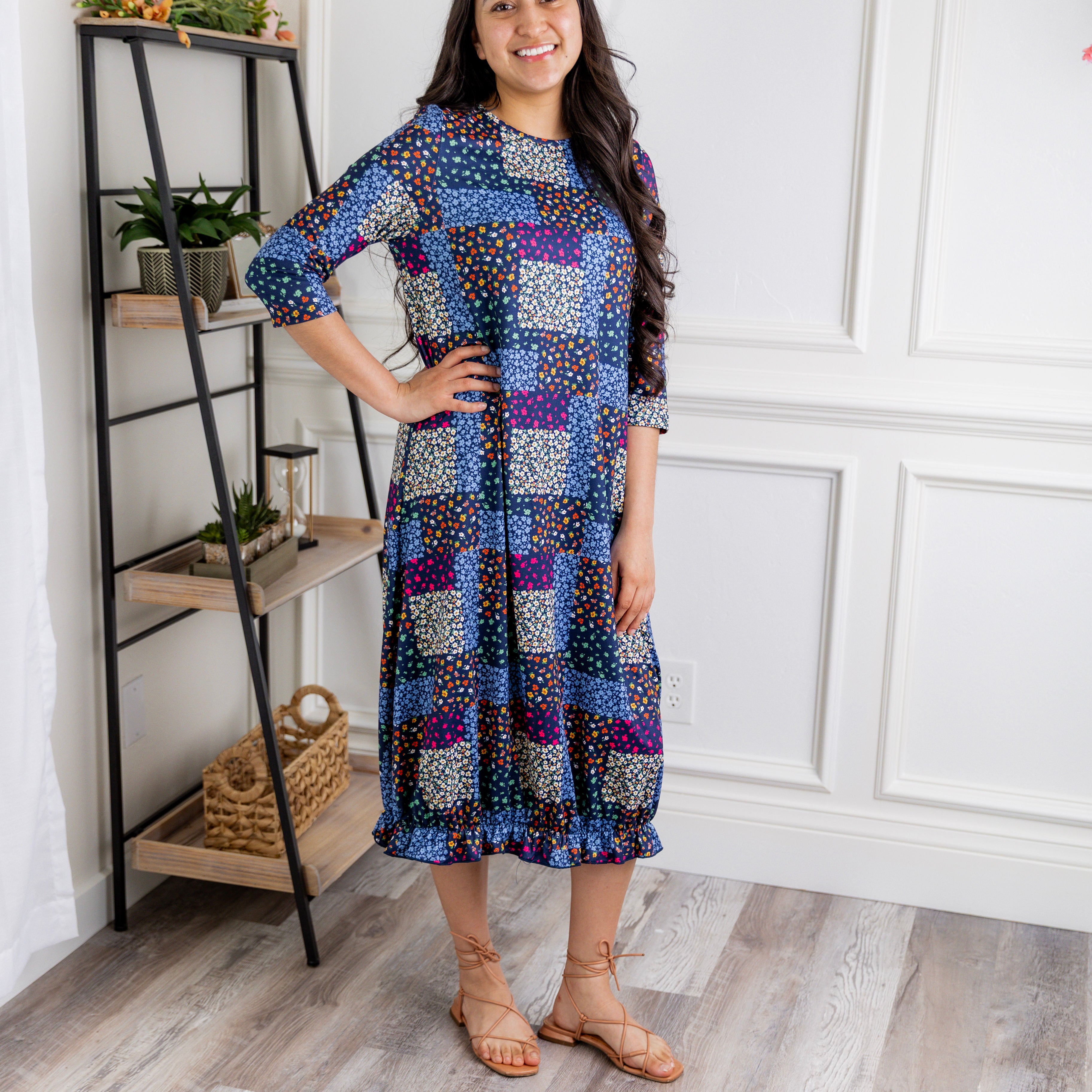 Model wearing our Nuggles® modest Bristol midi dress with 3/4 sleeves and elastic ruffle hem in various prints.
