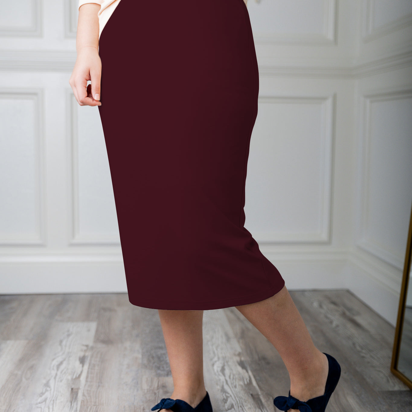 Modest midi skirt in soft knit fabric with a tapered hem and stretch waistband, shown in a classic neutral. A Nuggles favorite in 27", 31", and 34" lengths.