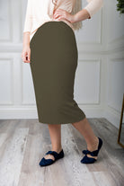 Modest midi skirt in soft knit fabric with a tapered hem and stretch waistband, shown in a classic neutral. A Nuggles favorite in 27", 31", and 34" lengths.