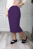 Modest midi skirt in soft knit fabric with a tapered hem and stretch waistband, shown in a classic neutral. A Nuggles favorite in 27", 31", and 34" lengths.