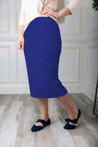 Modest midi skirt in soft knit fabric with a tapered hem and stretch waistband, shown in a classic neutral. A Nuggles favorite in 27", 31", and 34" lengths.