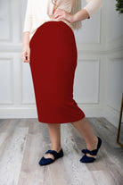 Modest midi skirt in soft knit fabric with a tapered hem and stretch waistband, shown in a classic neutral. A Nuggles favorite in 27", 31", and 34" lengths.