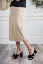 27" relaxed midi skirt displayed in a modest, mid-length cut with a smooth finish.