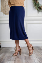 27" relaxed midi skirt displayed in a modest, mid-length cut with a smooth finish.