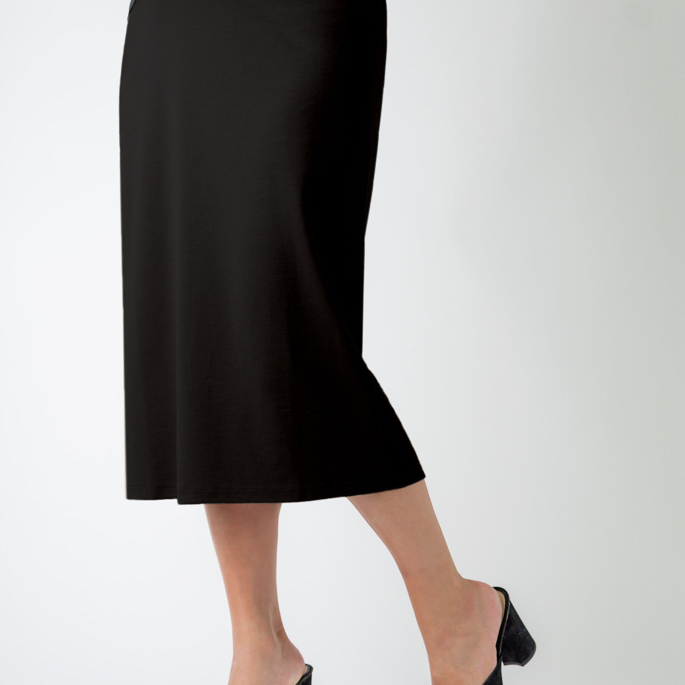 27" relaxed midi skirt displayed in a modest, mid-length cut with a smooth finish.