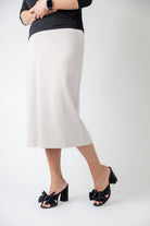 27" relaxed midi skirt displayed in a modest, mid-length cut with a smooth finish.