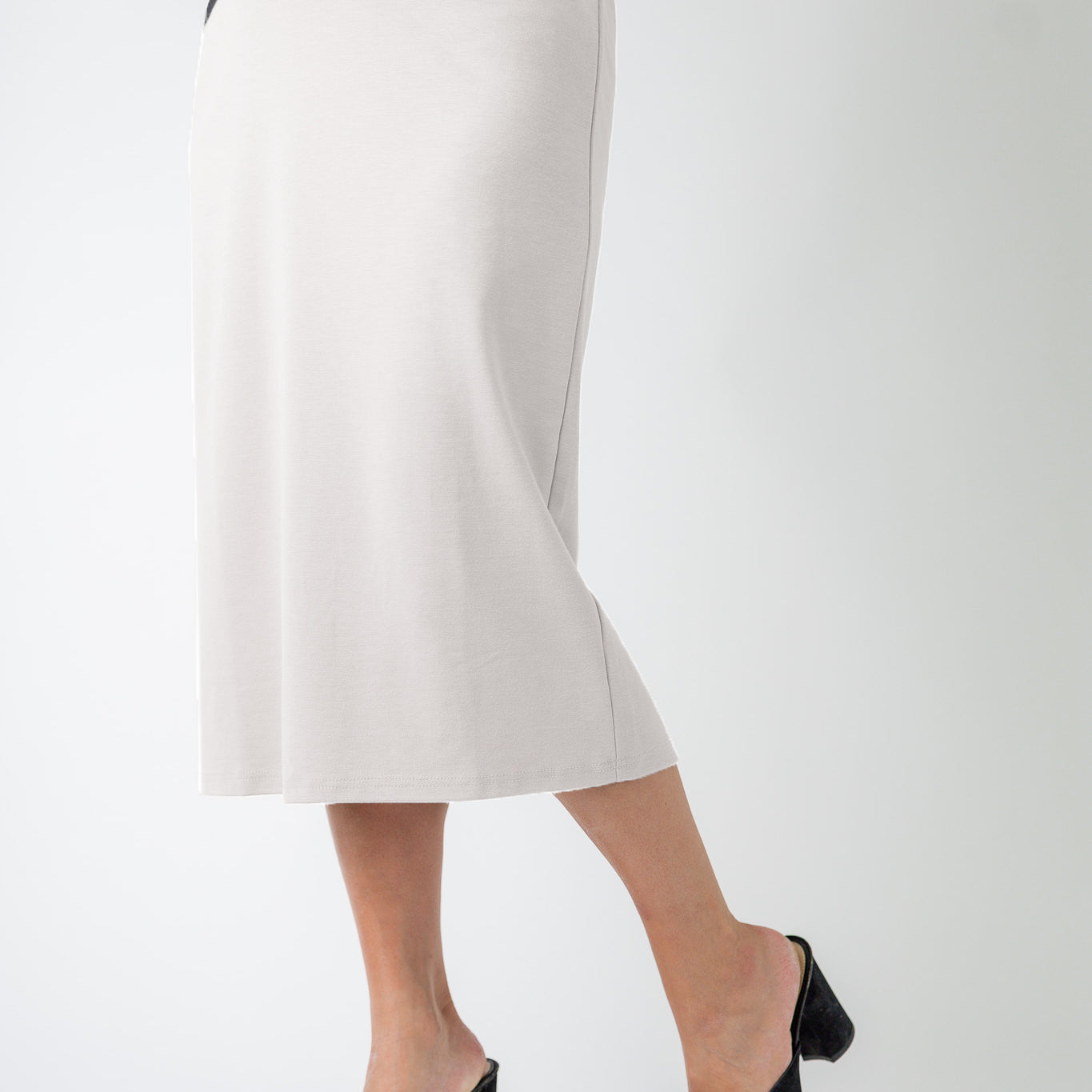 27" relaxed midi skirt displayed in a modest, mid-length cut with a smooth finish.