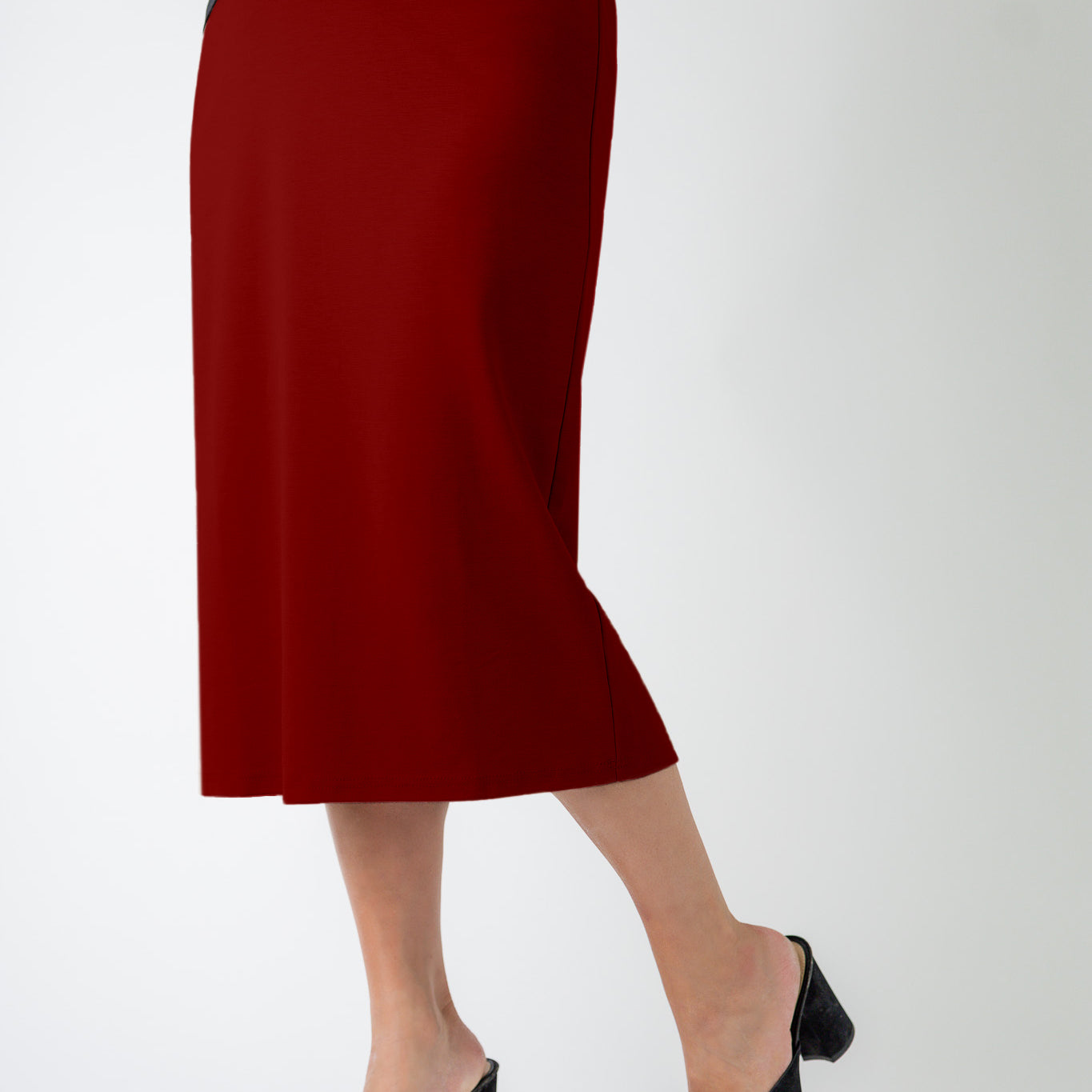 27" relaxed midi skirt displayed in a modest, mid-length cut with a smooth finish.