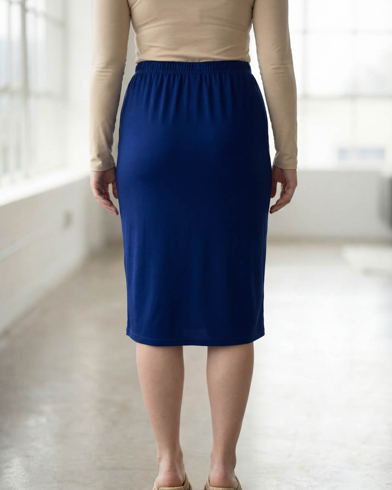 Model wearing Nuggles® 27" Classic Skirt in Dark Royal