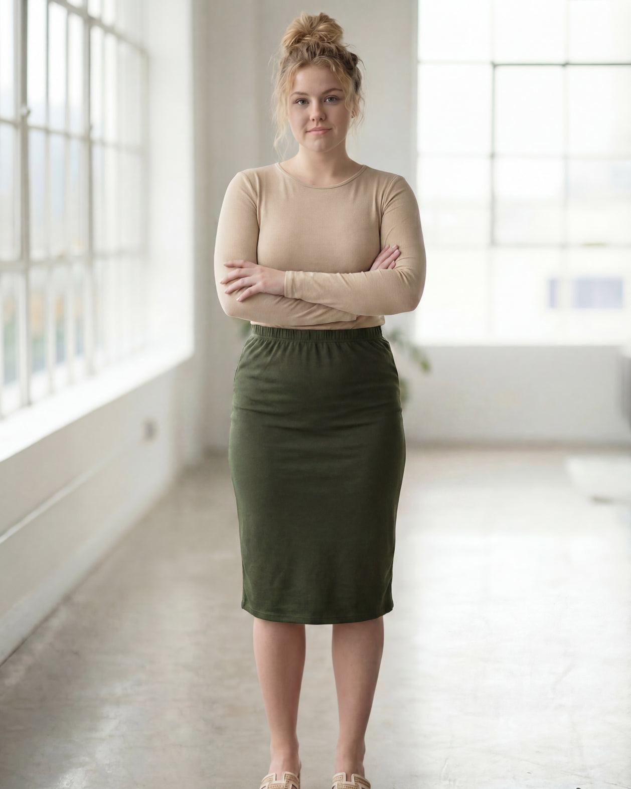 Model wearing Nuggles® 27" Classic Skirt in Olive Green
