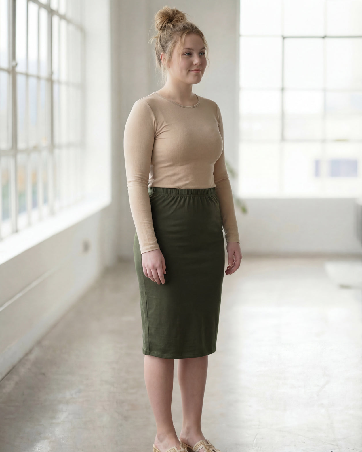 Model wearing Nuggles® 27" Classic Skirt in Olive Green