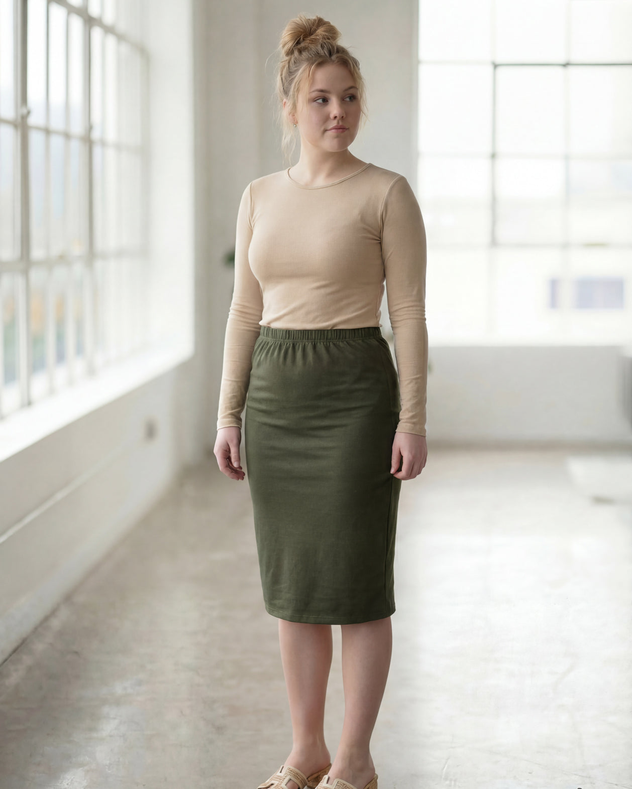 Model wearing Nuggles® 27" Classic Skirt in Olive Green