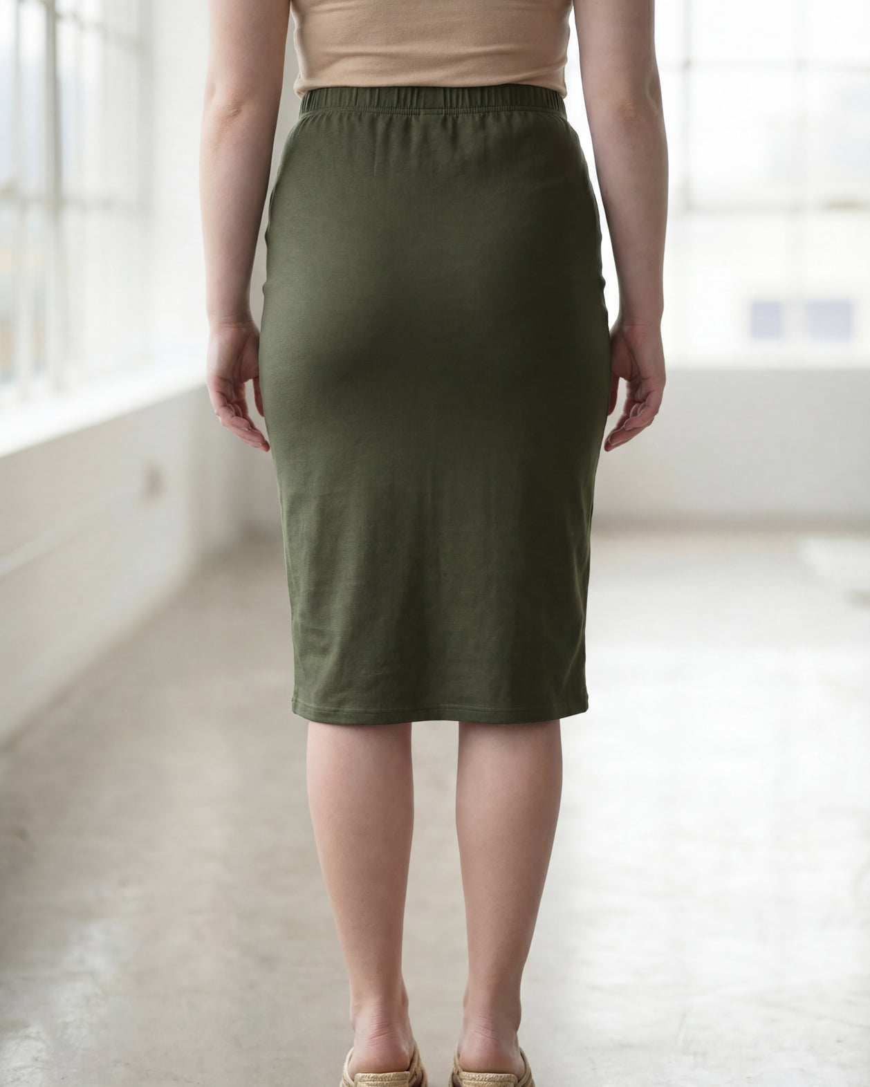 Model wearing Nuggles® 27" Classic Skirt in Olive Green