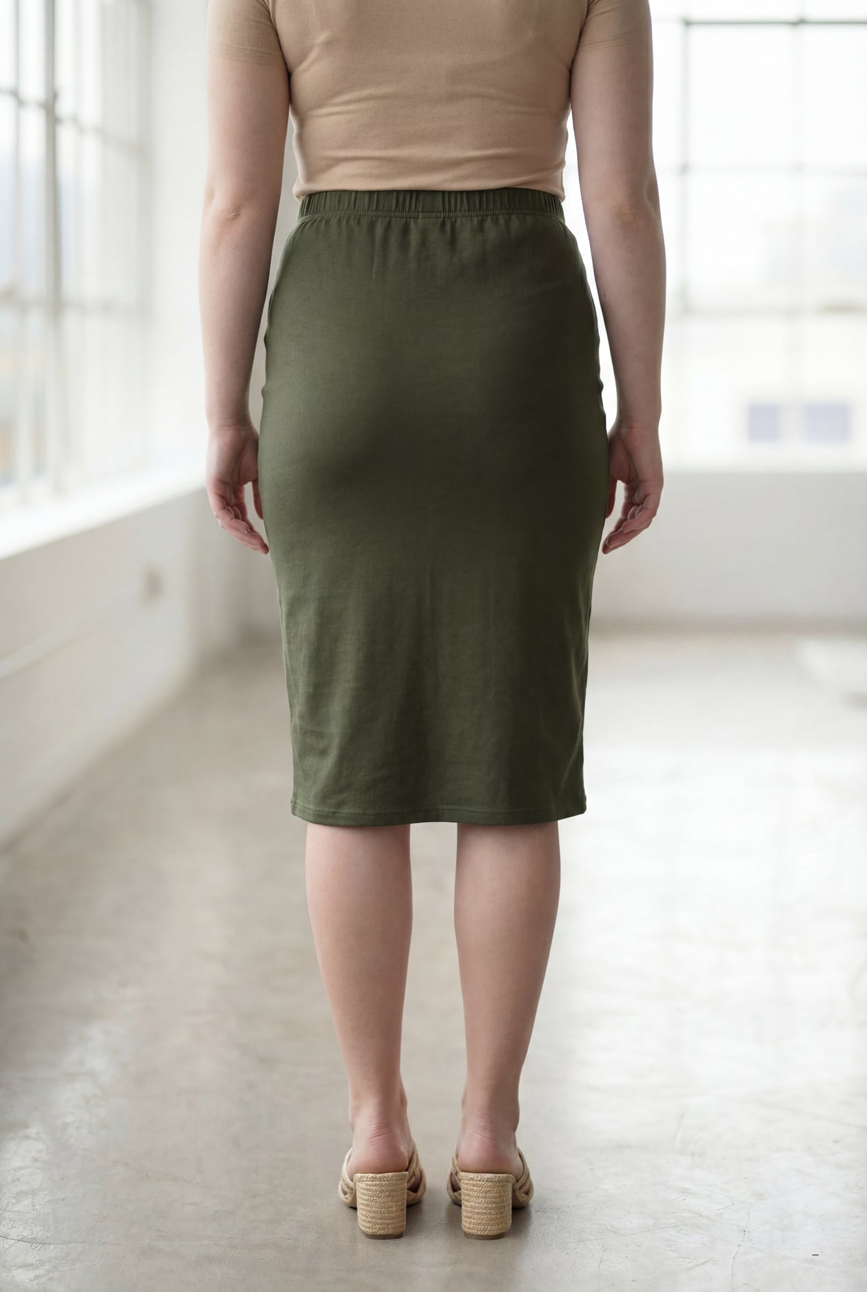 Model wearing Nuggles® 27" Classic Skirt in Olive Green