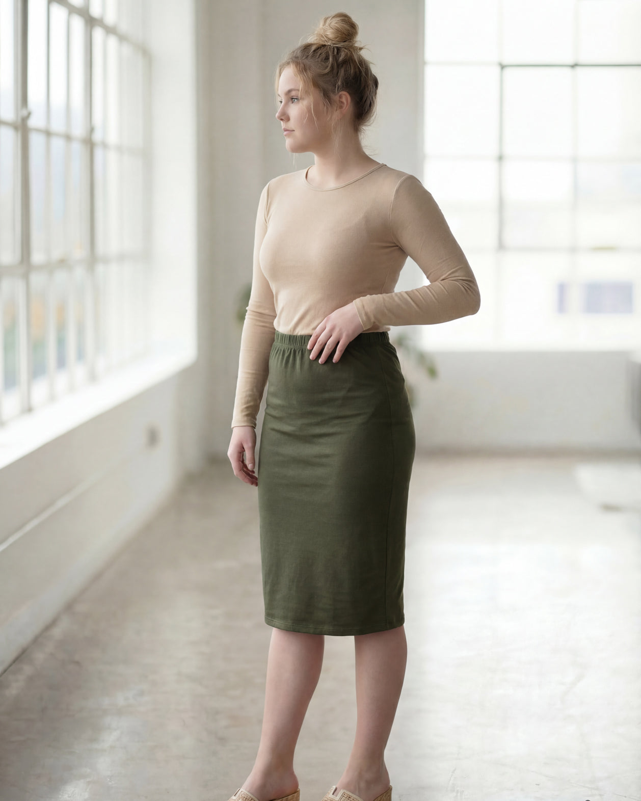 Model wearing Nuggles® 27" Classic Skirt in Olive Green