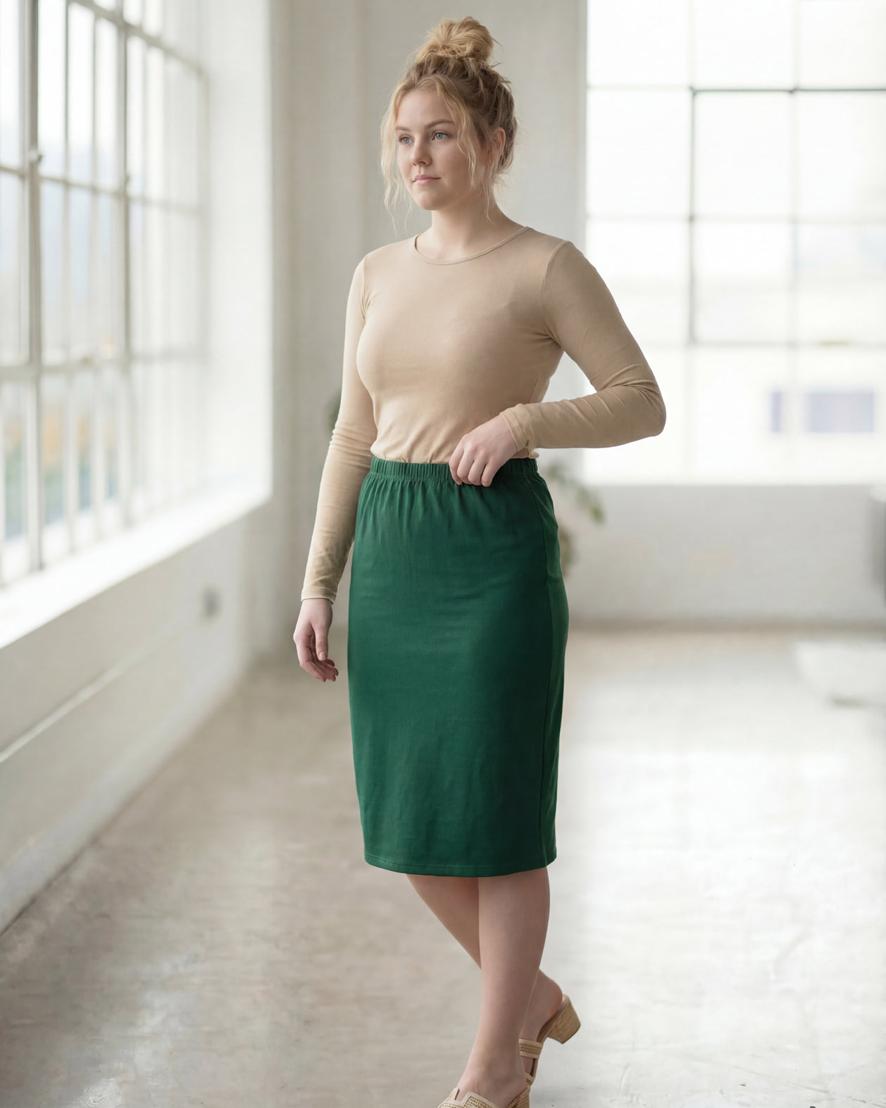Model wearing Nuggles® 27" Classic Skirt in Pine Green