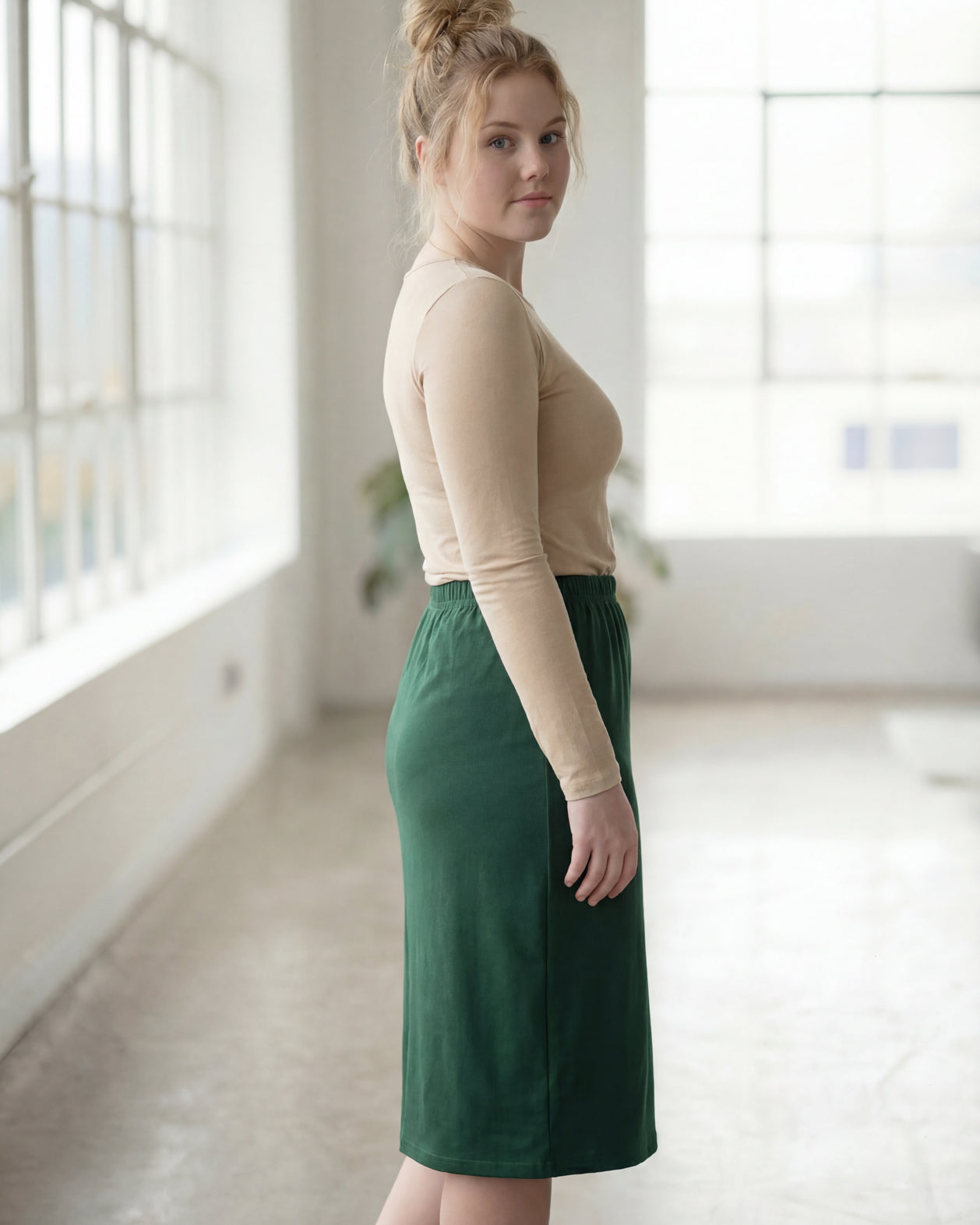 Model wearing Nuggles® 27" Classic Skirt in Pine Green