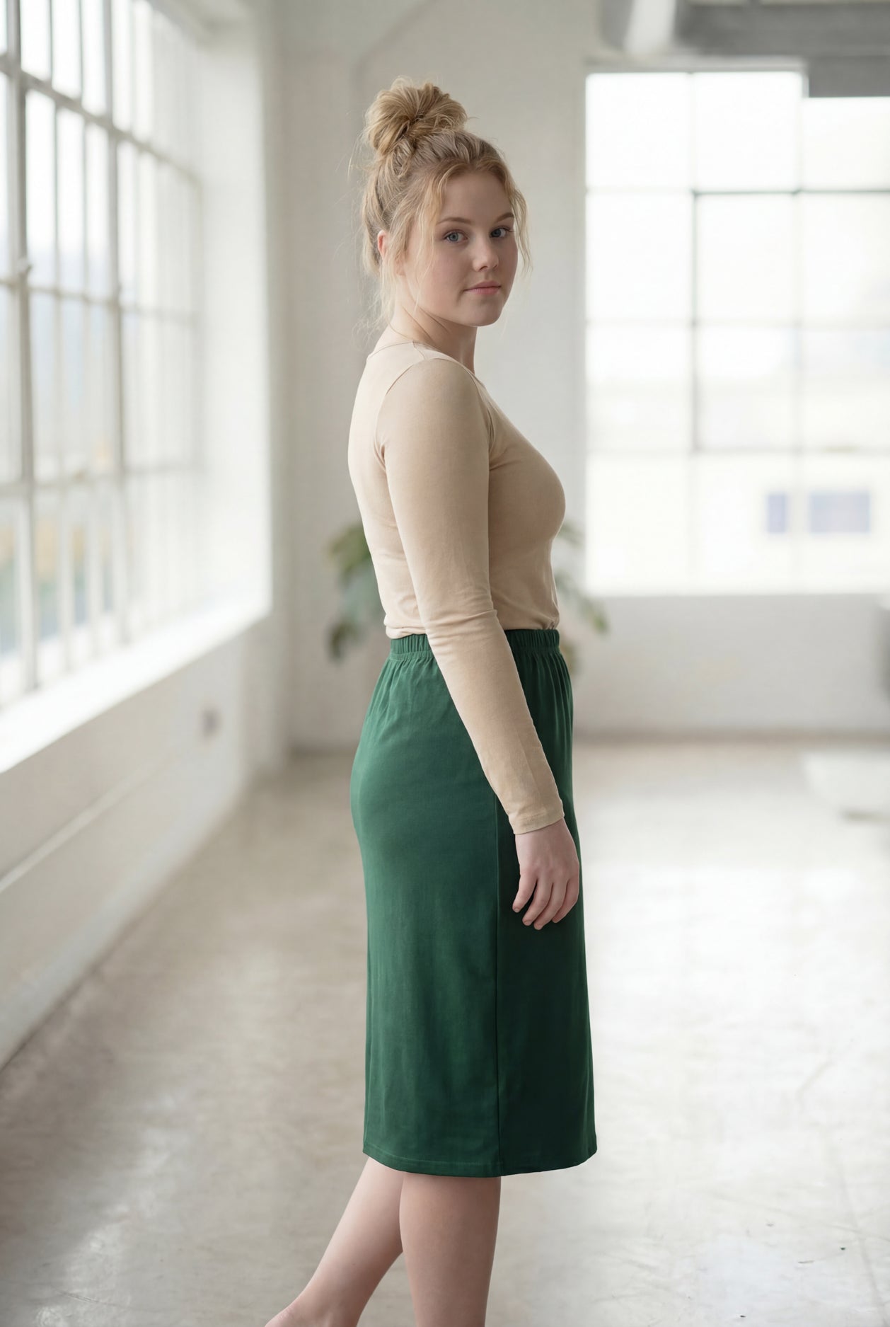 Model wearing Nuggles® 27" Classic Skirt in Pine Green