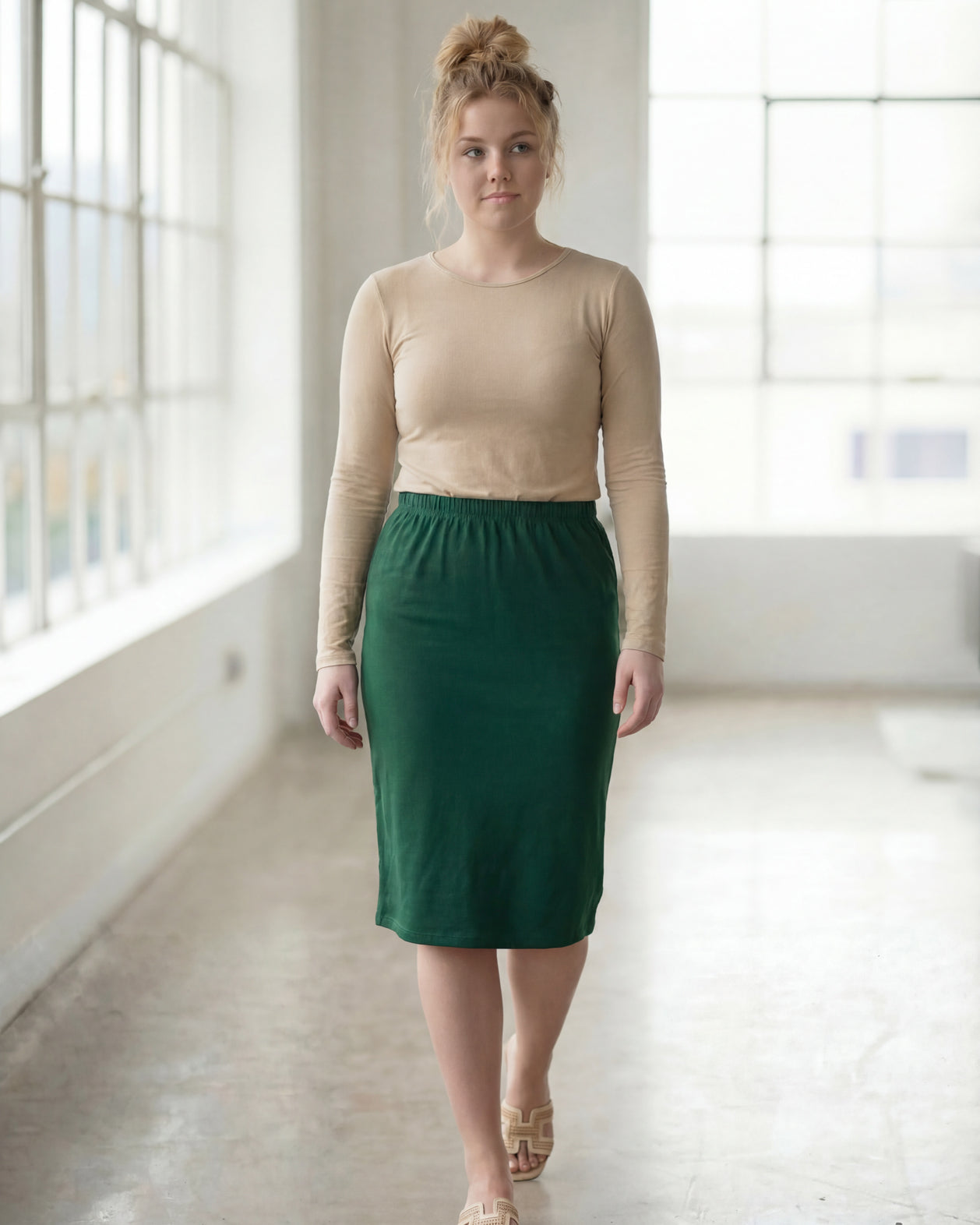 Model wearing Nuggles® 27" Classic Skirt in Pine Green