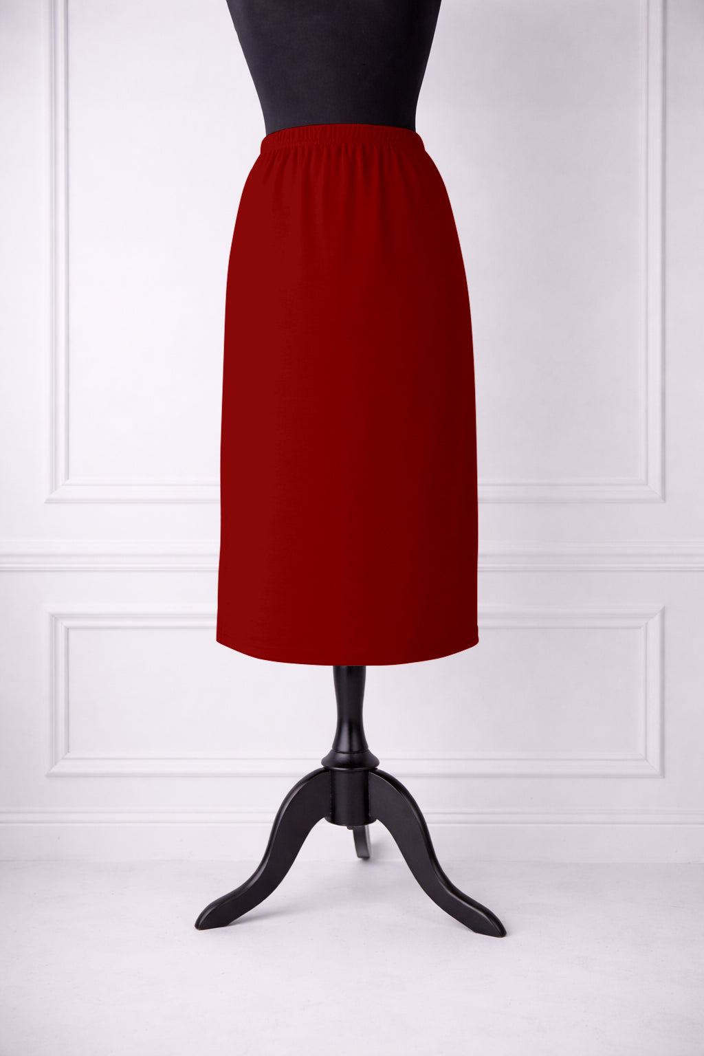 Stock photo of our Nuggles® 27-inch classic skirt elastic waistband and straight silhouette in Brick Red