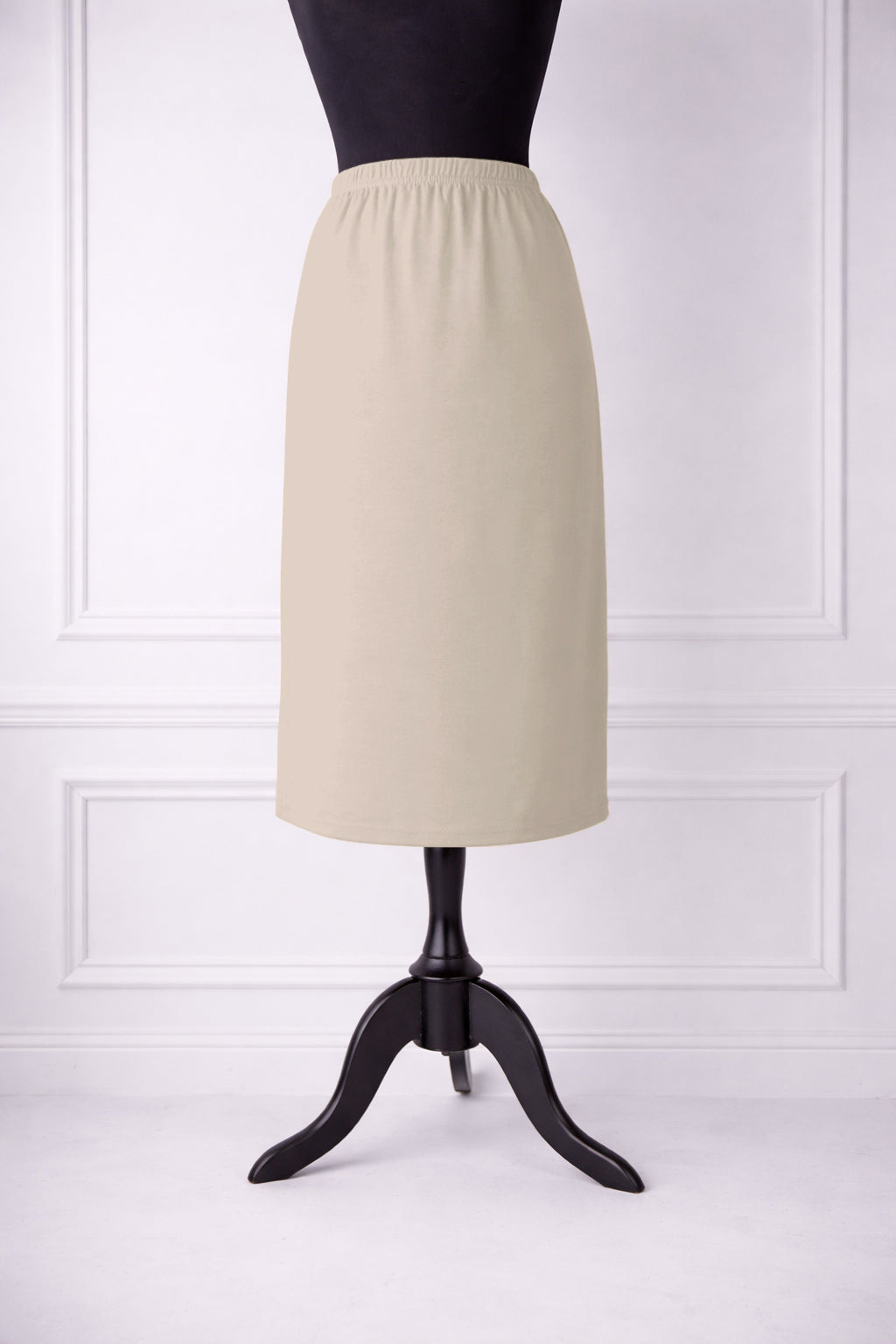 Stock photo of our Nuggles® 27-inch classic skirt elastic waistband and straight silhouette in Nude
