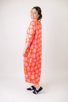 Model wearing Emma Bubble Dress in pretty prints, showcasing full bubble skirt and modest fit.
