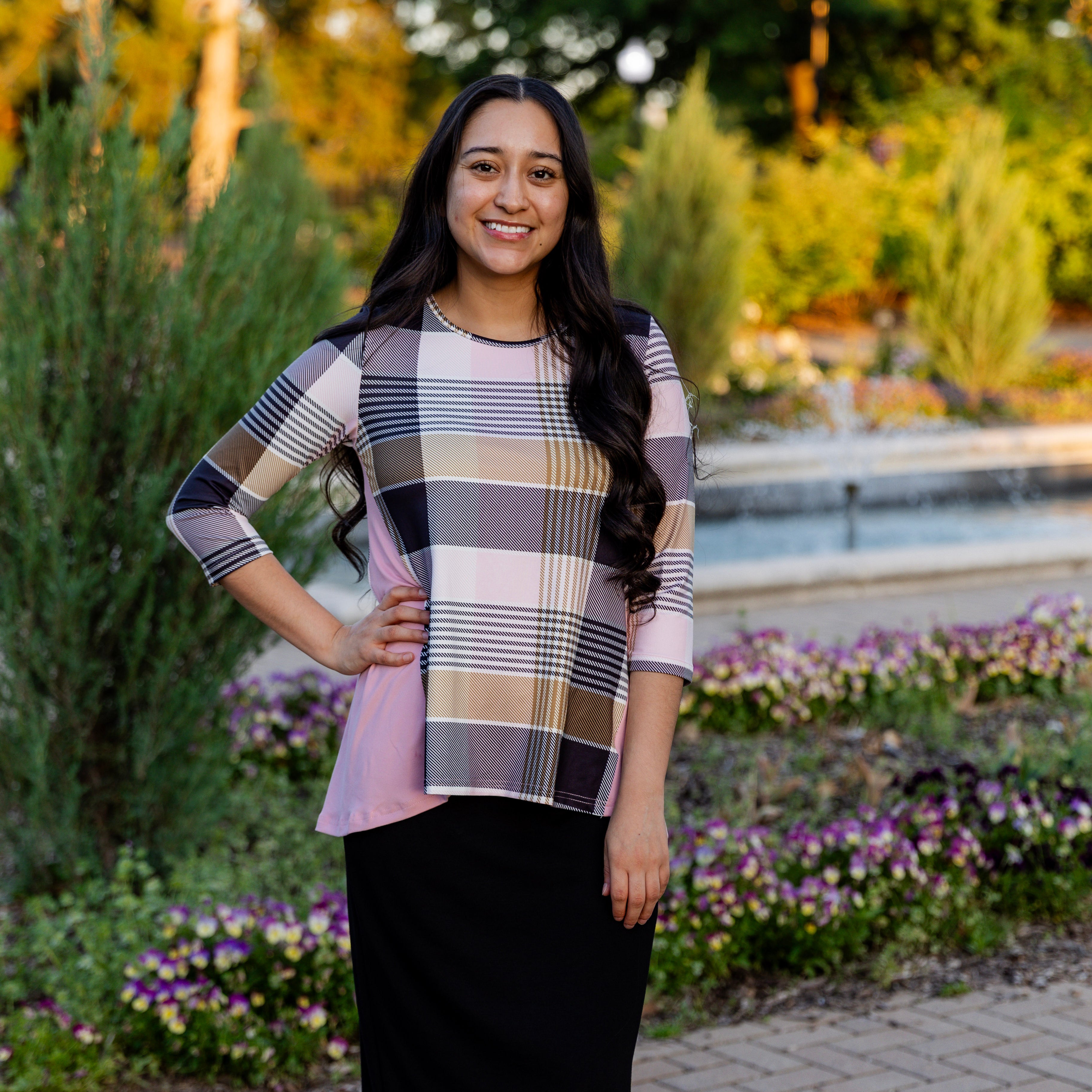 Model wearing the Adrielle Top with 3/4 sleeves and a classic skirt – modest women's top from Nuggles®