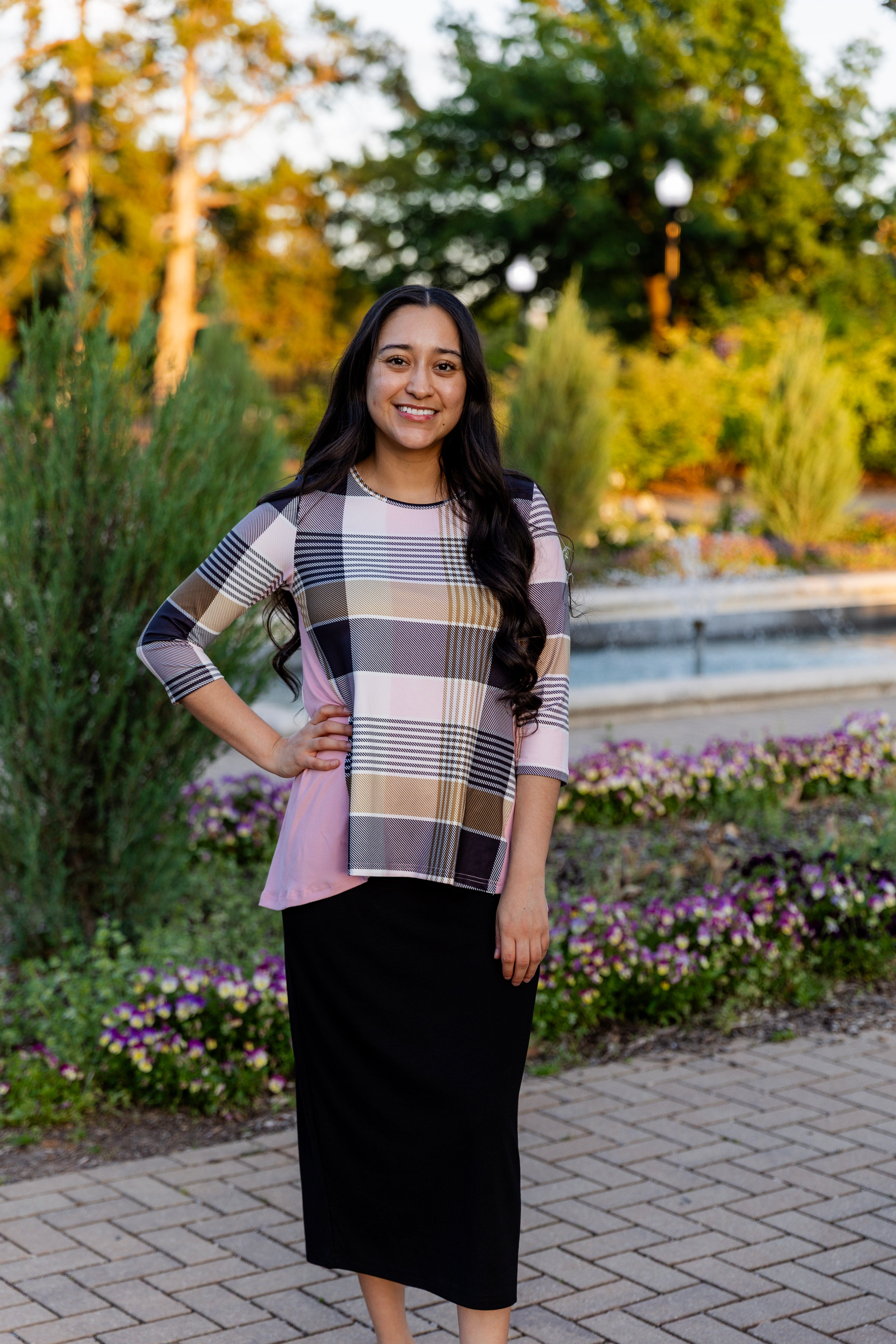 Model wearing the Adrielle Top with 3/4 sleeves and a classic skirt – modest women's top from Nuggles®