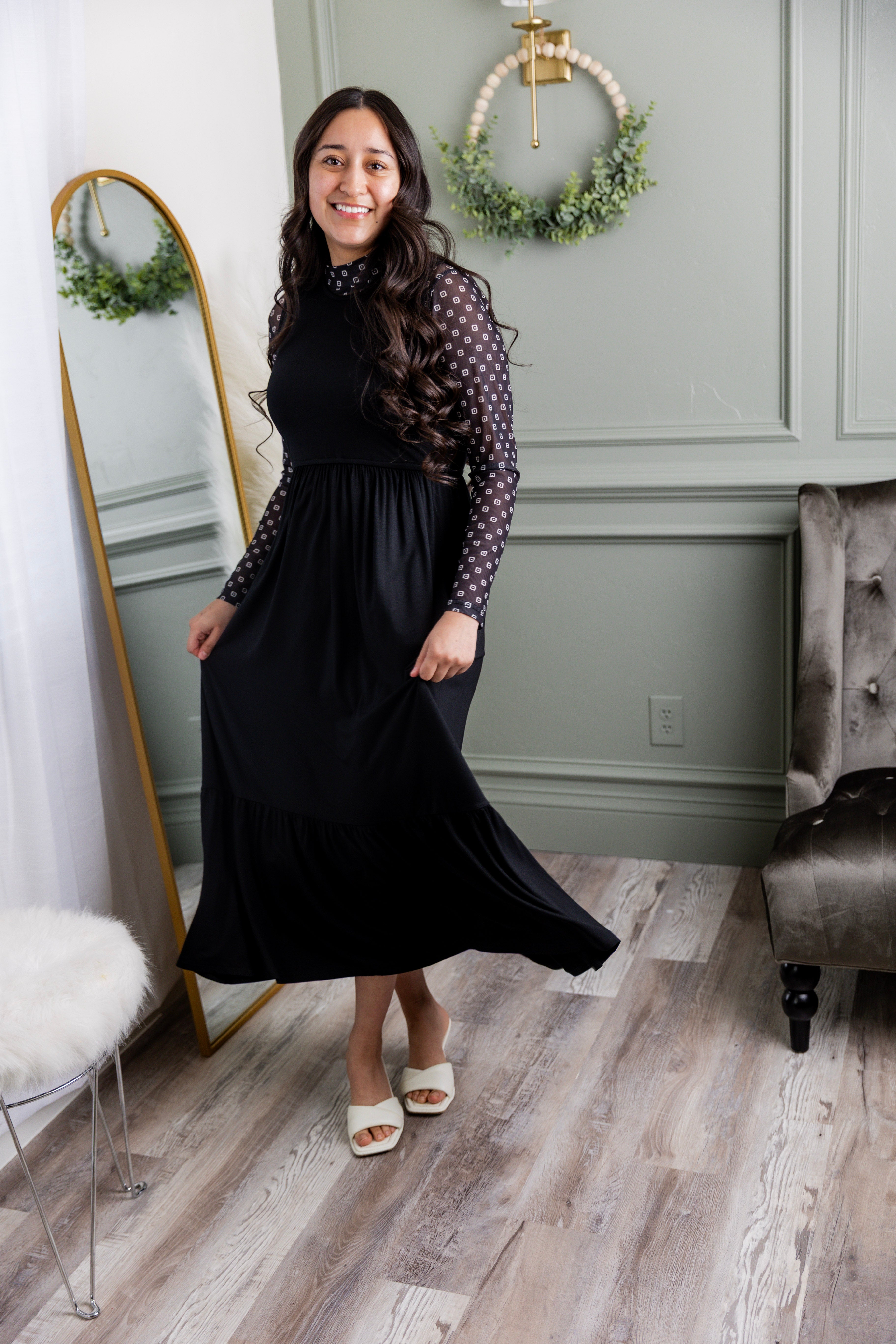 Model wearing the Nuggles® Riley Dress in Black