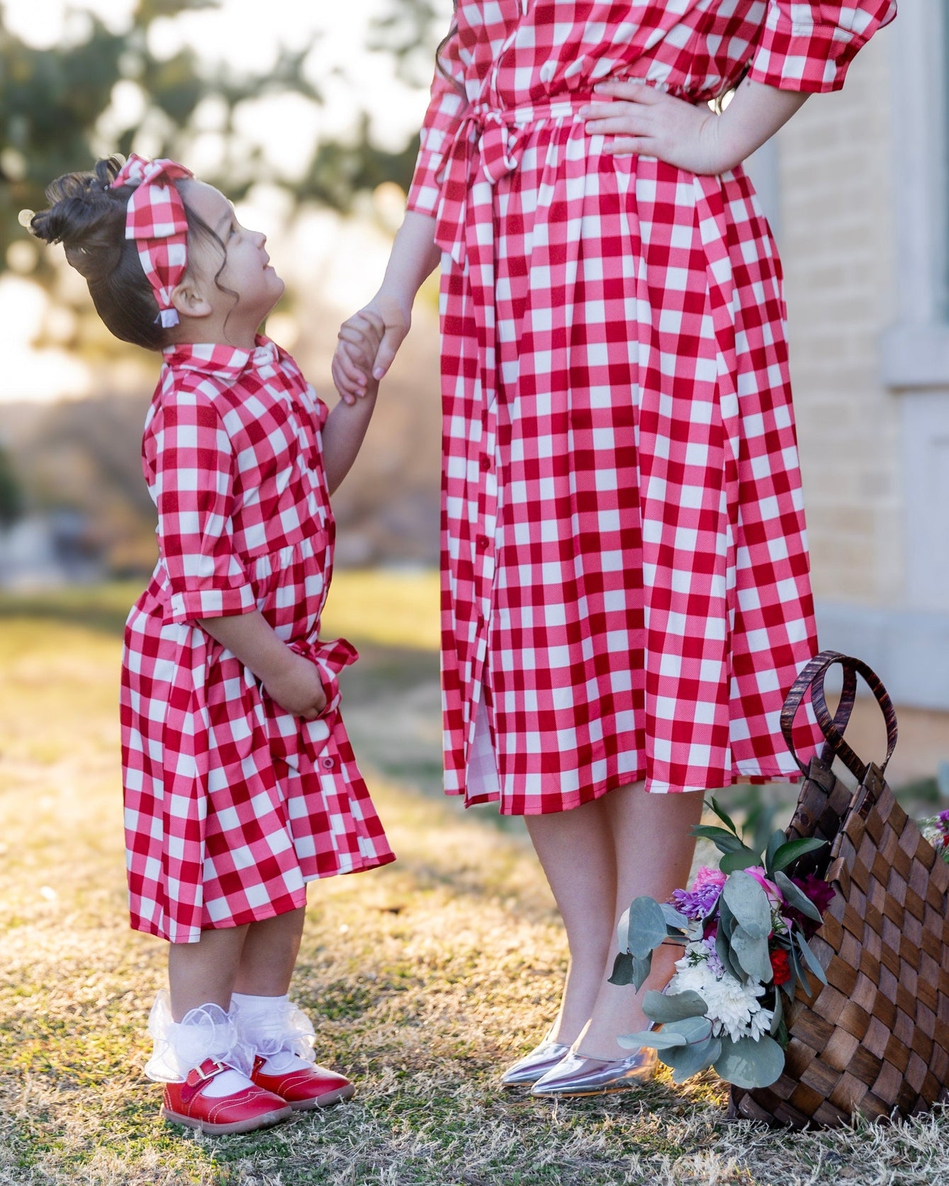 Model wearing the Nuggles® Girls' Rachel Dress in Cherry Jam