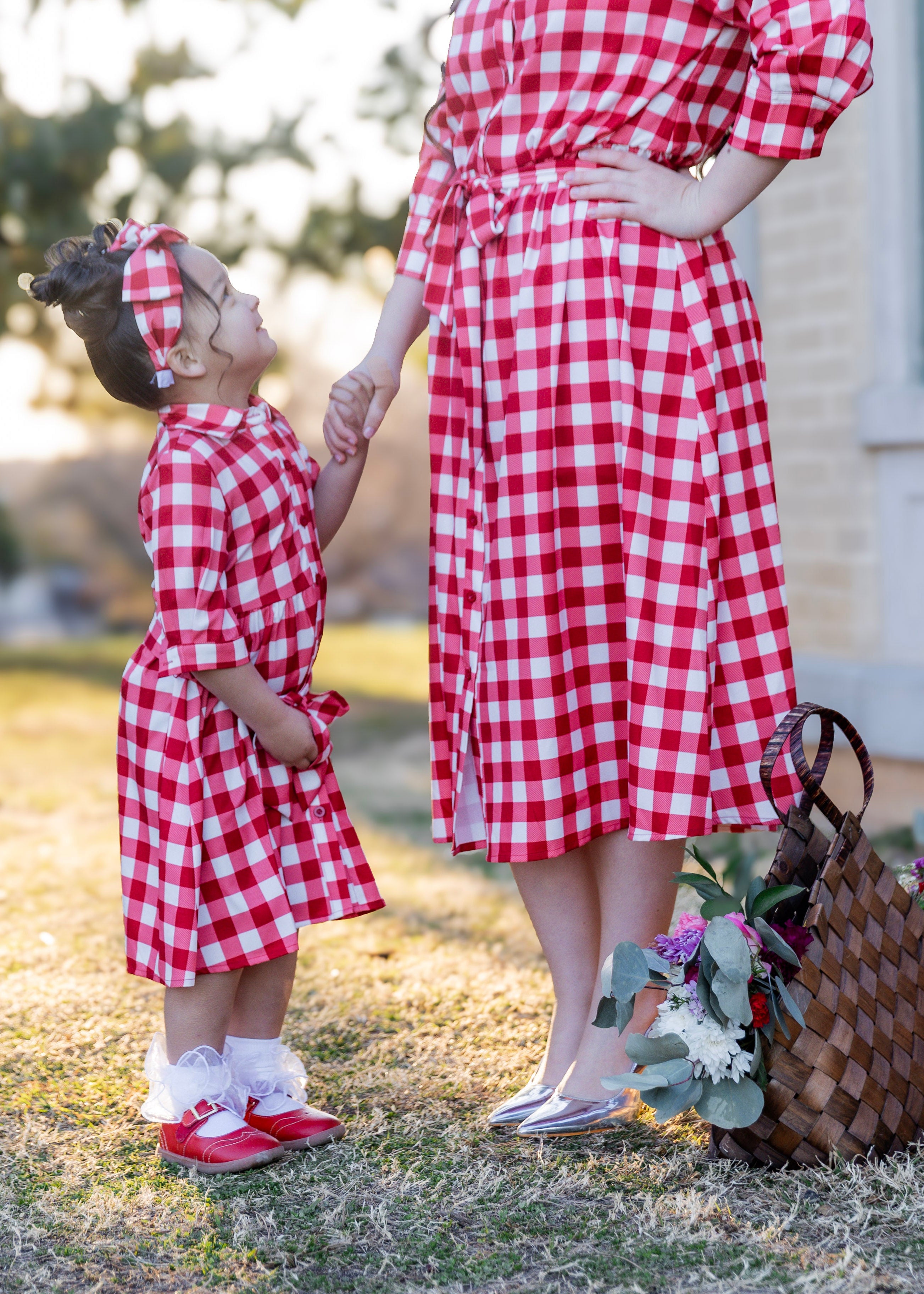 Model wearing the Nuggles® Girls' Rachel Dress in Cherry Jam
