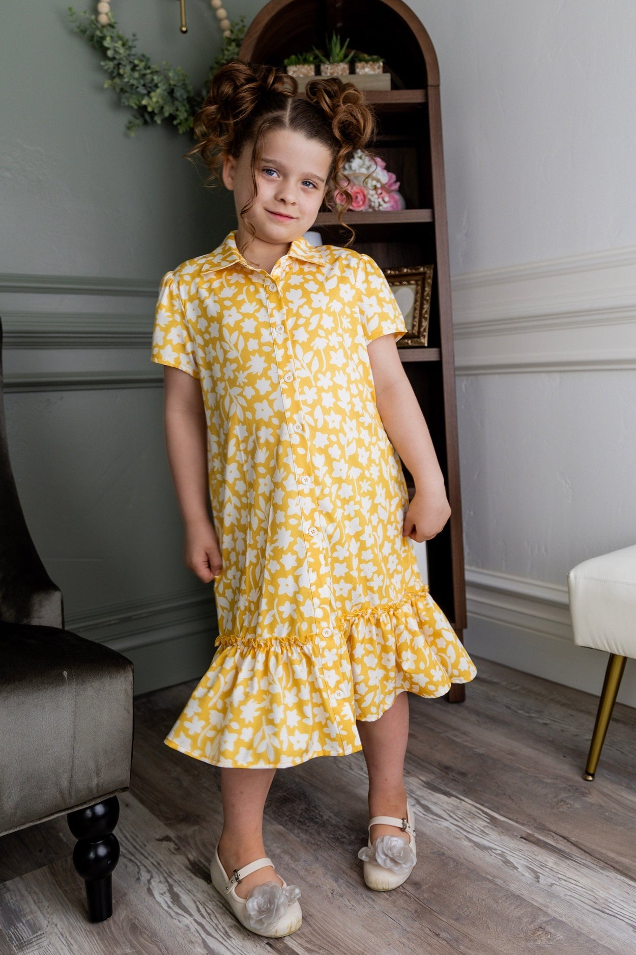 Model wearing Nuggles® Girls' Ellie Dress Dress in Sunshine Sprigs