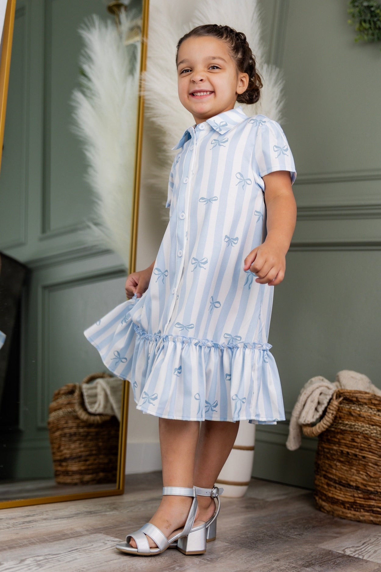 Model wearing Nuggles® Girls' Ellie Dress Dress in Sweet Ribbon Stripe