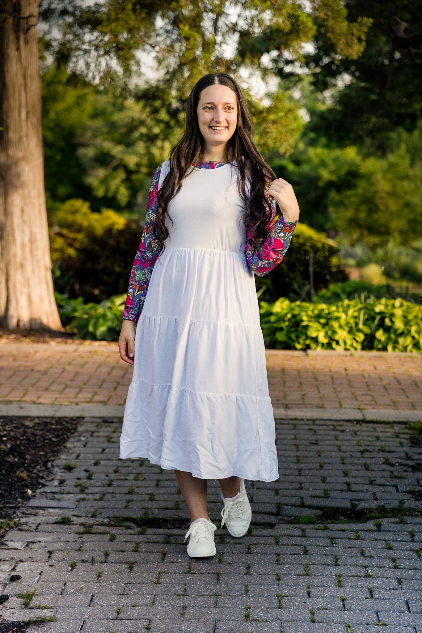 Modest sleeveless midi dress with tiered skirt and fitted bodice, styled for layering with a crew neckline – Hannah Layering Dress by Nuggles®.