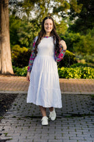 Modest sleeveless midi dress with tiered skirt and fitted bodice, styled for layering with a crew neckline – Hannah Layering Dress by Nuggles®.