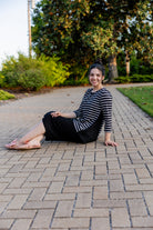 Model wearing the Adrielle Top with 3/4 sleeves and a classic skirt – modest women's top from Nuggles®