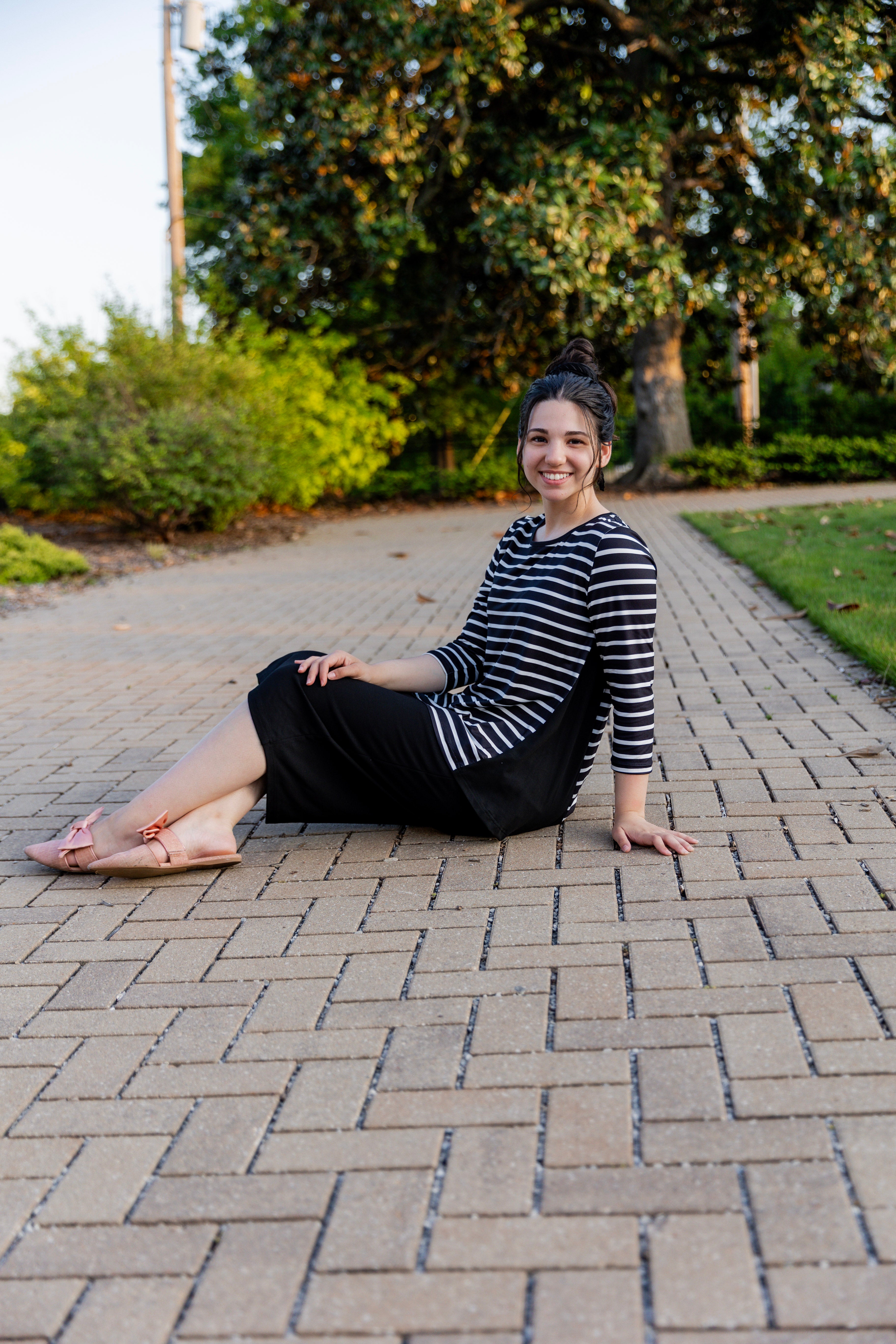 Model wearing the Adrielle Top with 3/4 sleeves and a classic skirt – modest women's top from Nuggles®