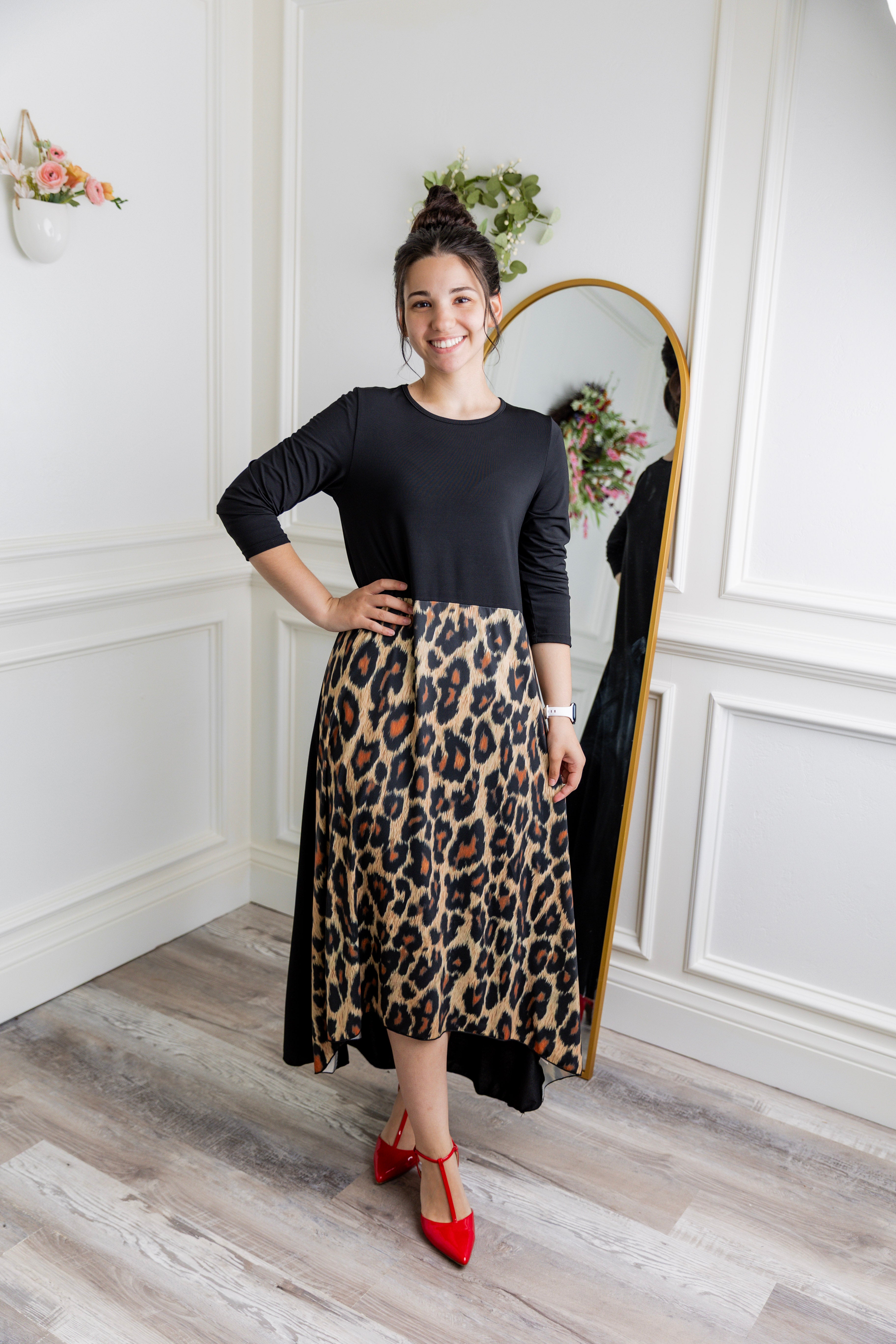 Model modeling Nuggles® Charay Dress with ¾ sleeves and high-low hem. Modest and stylish A-line dress with flattering fit.