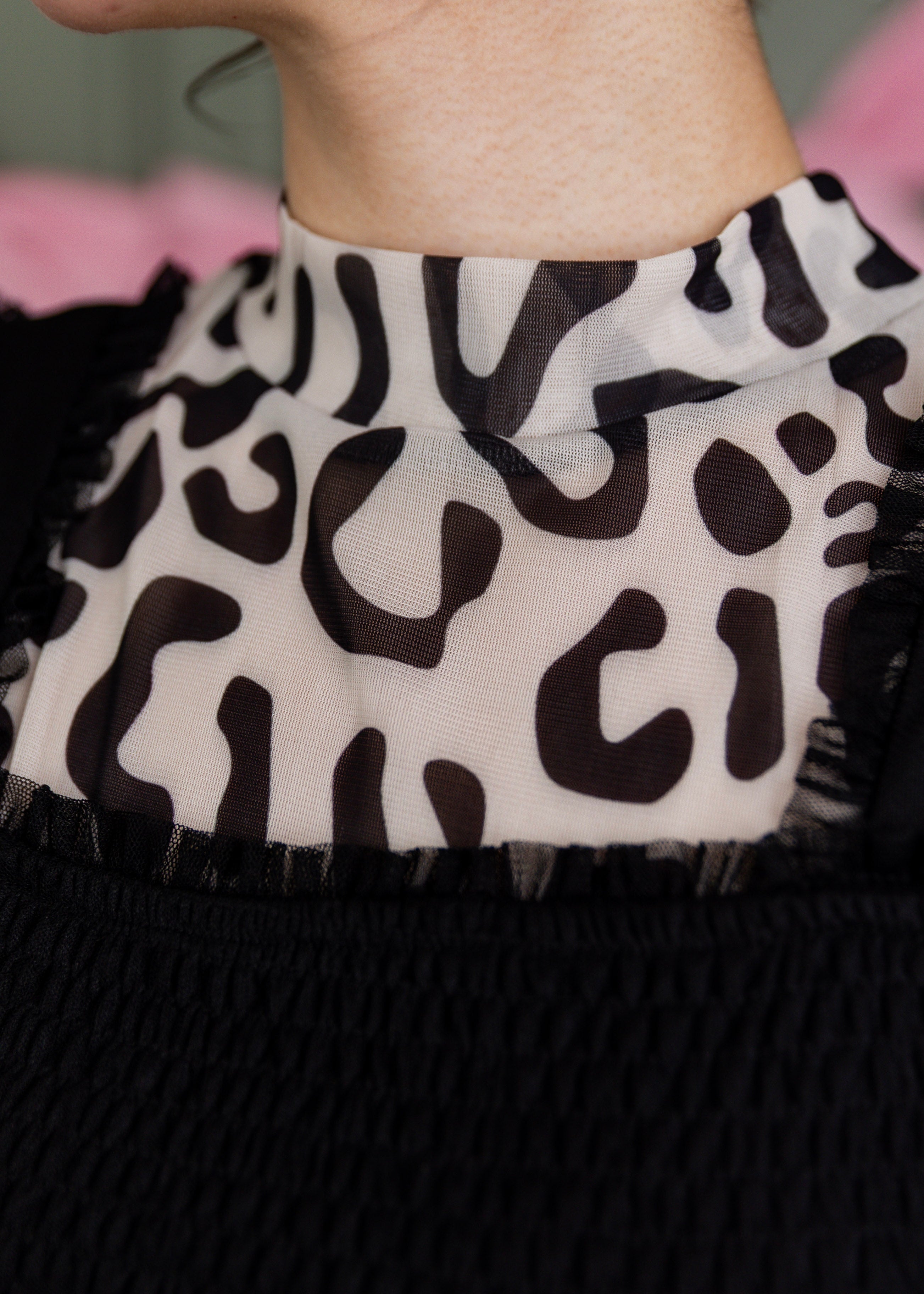 Model wearing Nuggles® Mesh Tee top in Snow Leopard