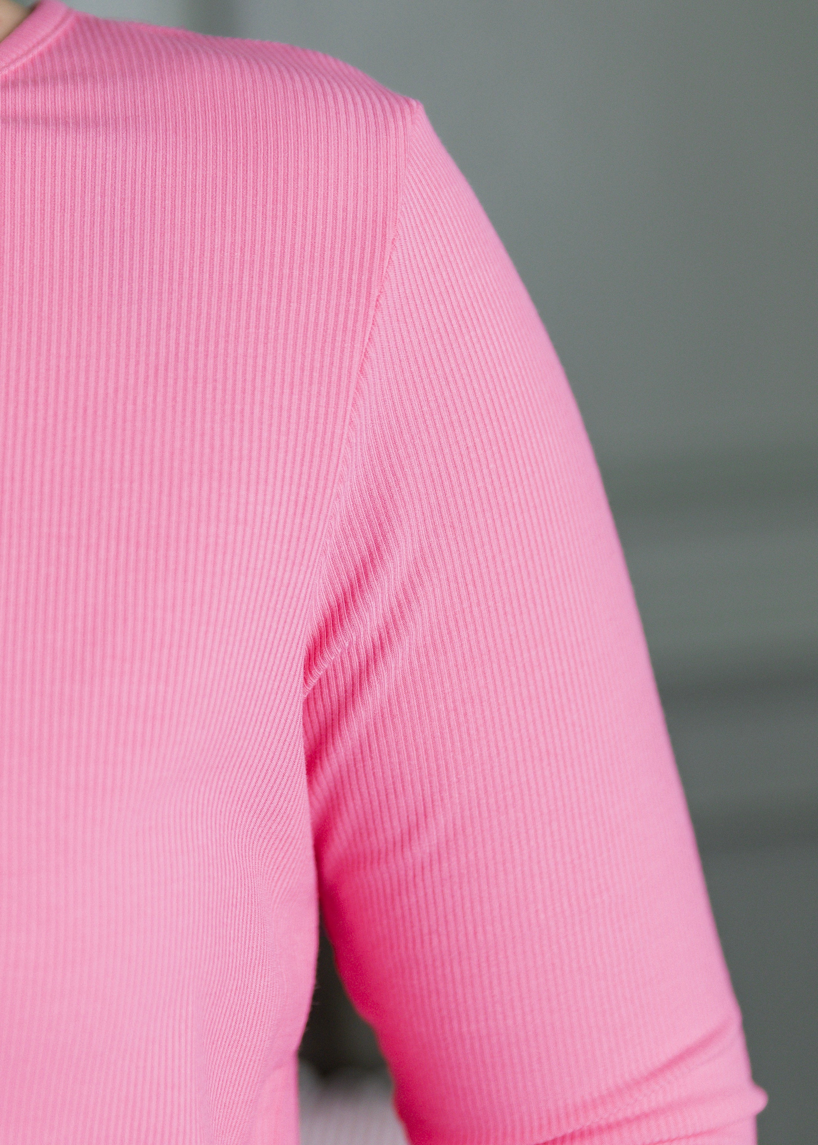 Model in our Nuggles® Ribbed Midi Layering Dress in Pink