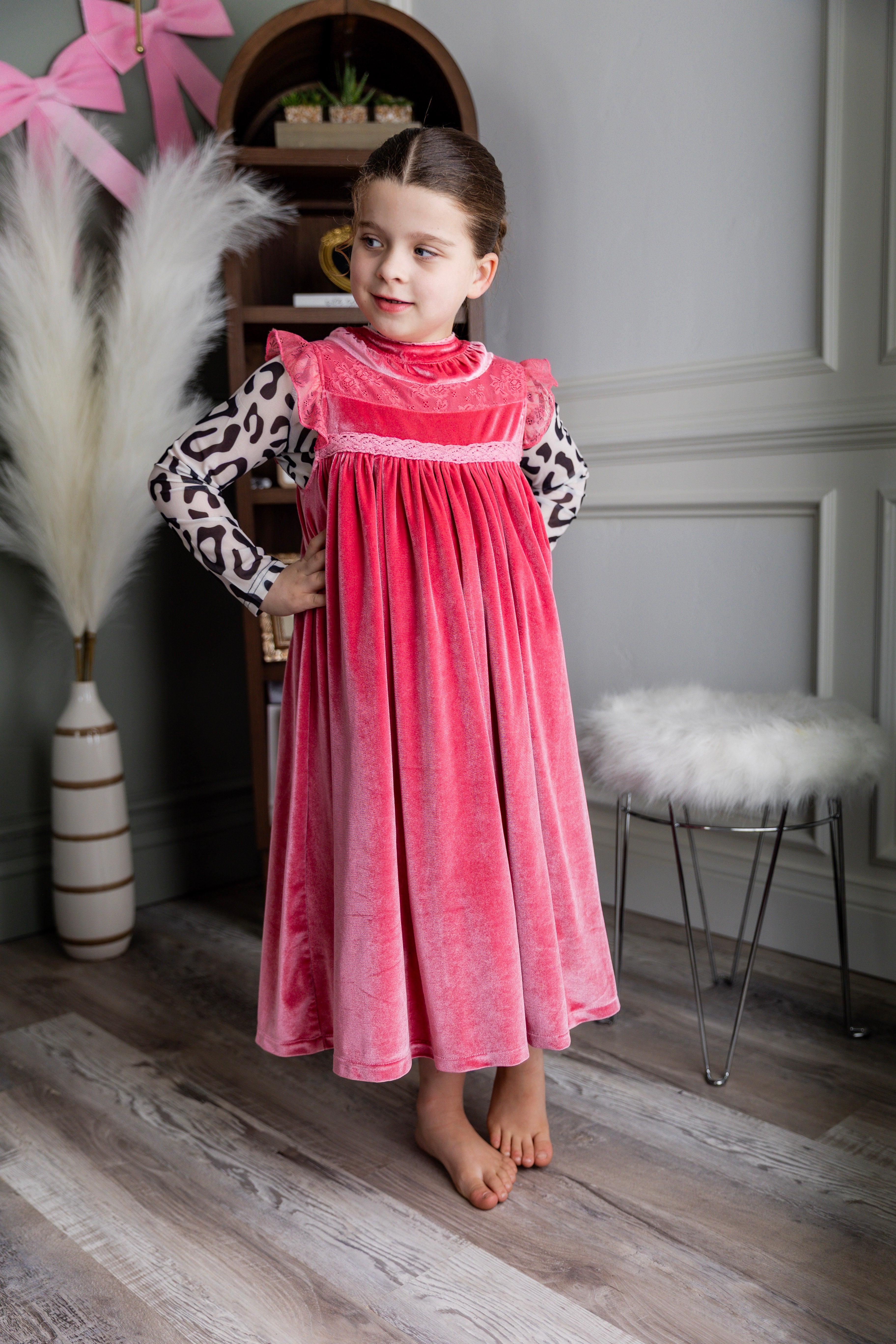 Model wearing Nuggles® Girls' Mesh Tee in Snow Leopard