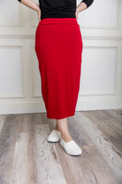 Model showcasing  Nuggles® midi tee skirts in various solid colors, modest 27" and 31" lengths
