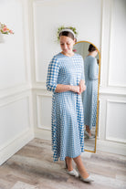 Model wearing the Nuggles® Liana Dress – modest midi dress with ¾ sleeves
