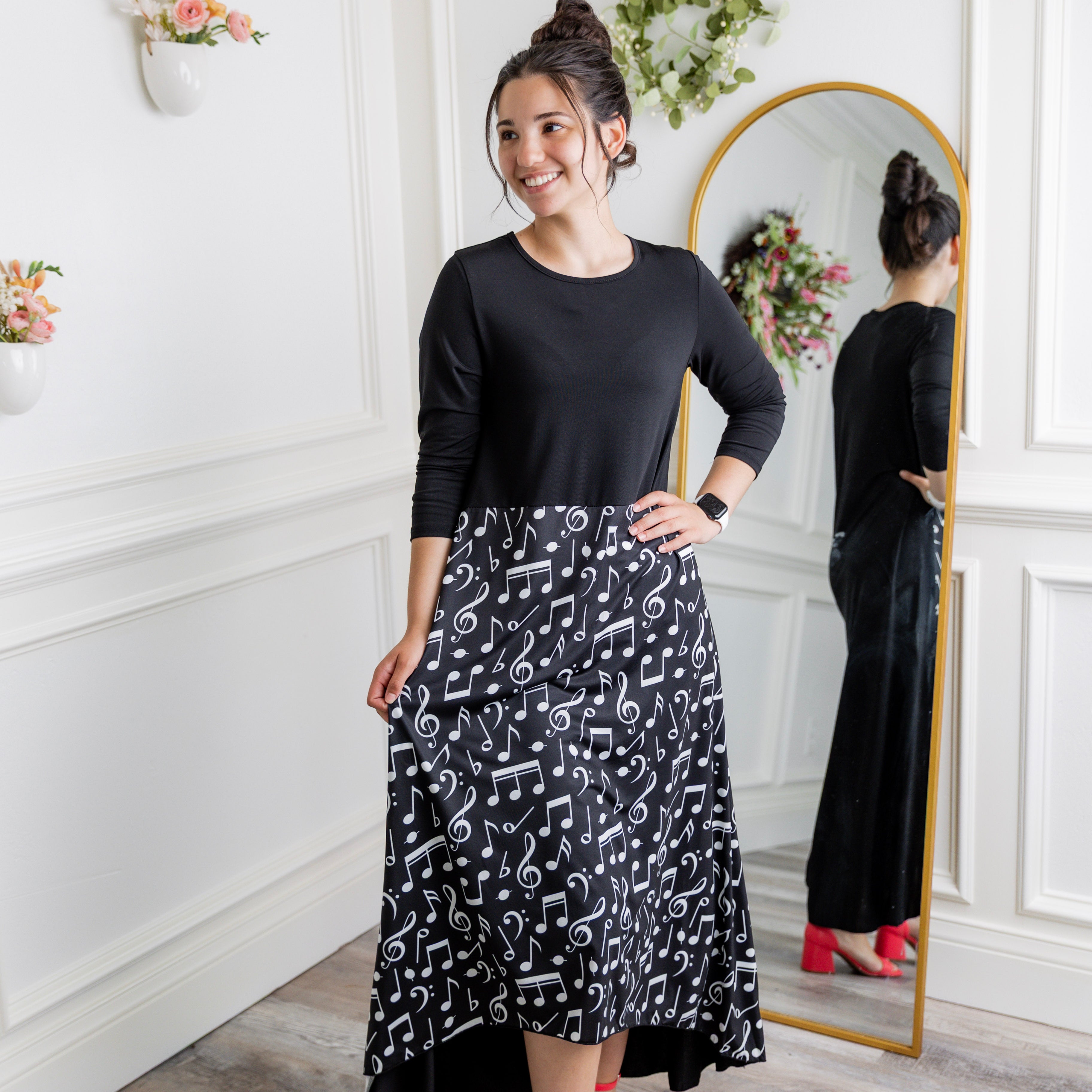 Model modeling Nuggles® Charay Dress with ¾ sleeves and high-low hem. Modest and stylish A-line dress with flattering fit.