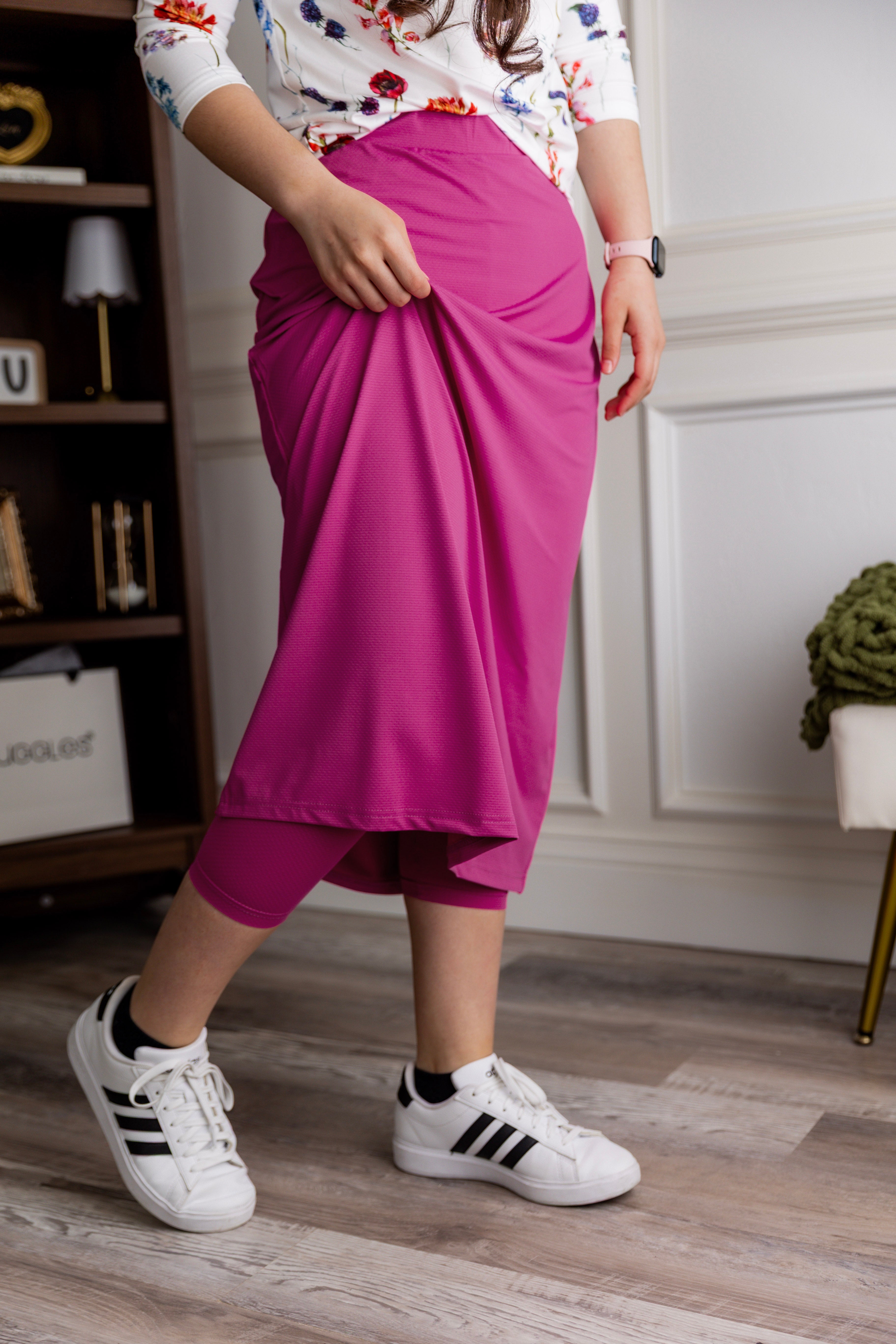 Model wearing Nuggles® 31" All-Sport Skirt in Hot Pink