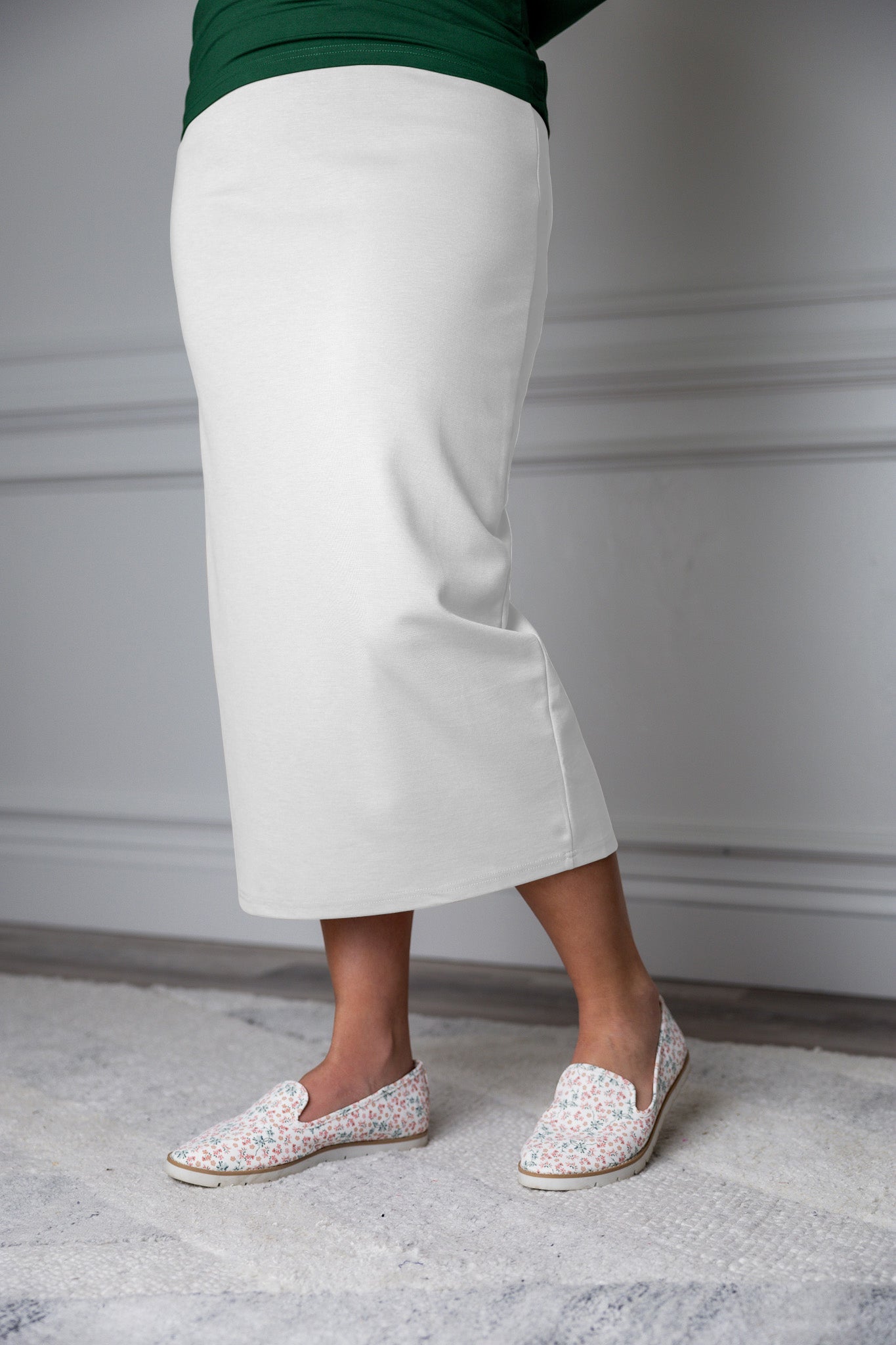 31"Modest knit midi skirt with elastic waistband, available in various colors and lengths—27, 31, and 34 inches.