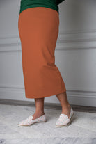 31"Modest knit midi skirt with elastic waistband, available in various colors and lengths—27, 31, and 34 inches.